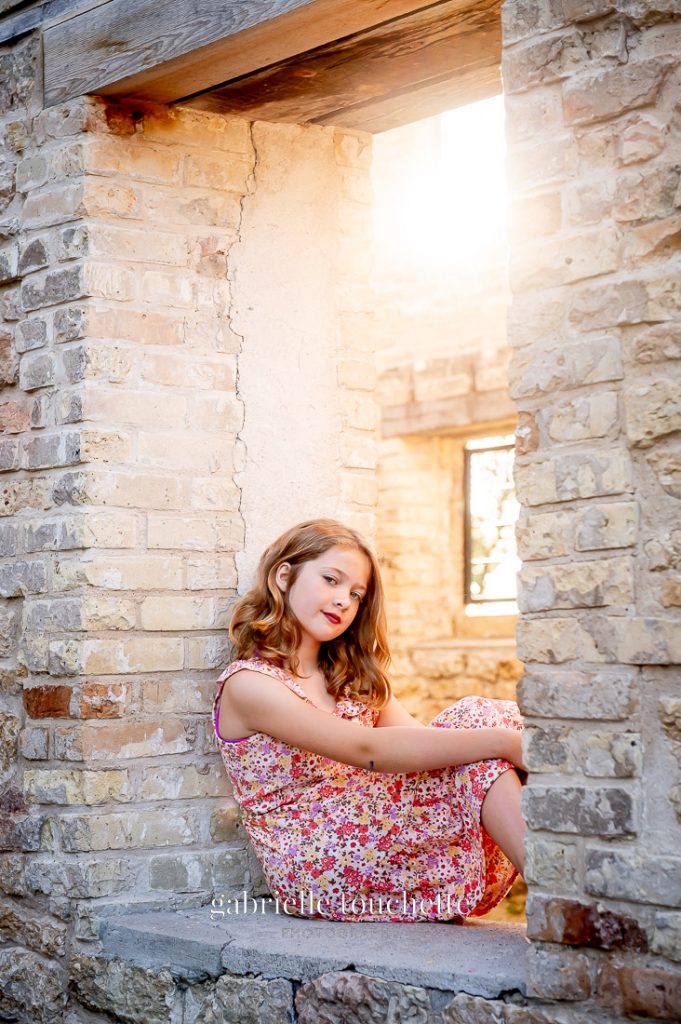 Portrait of a girl in hazy sunset light at the Trappist monastery ruins in Saint Norbert Manitoba