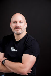 Professional headshot in Winnipeg studio for a personal brand featuring a natural casual portrait with clean lighting and polished editing for entrepreneurs, coaches, and consultants.