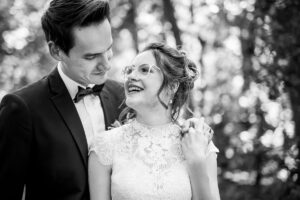 Classic black and white wedding portrait in Winnipeg showing a bride and groom in a professional, timeless photography style with natural emotion and connection.