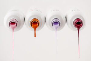 Professional product and branding photography in Winnipeg showcasing nail polish bottles for a local nail salon, created as styled studio imagery for business marketing and promotion.