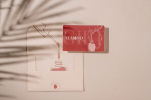 Professional commercial flat lay photography in Winnipeg showcasing a gift card and envelope styled by a photo stylist with modern lighting and textured background for branding and advertising content.