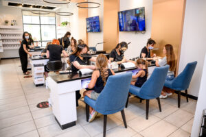 Almond Nail Bar customer receiving a professional manicure