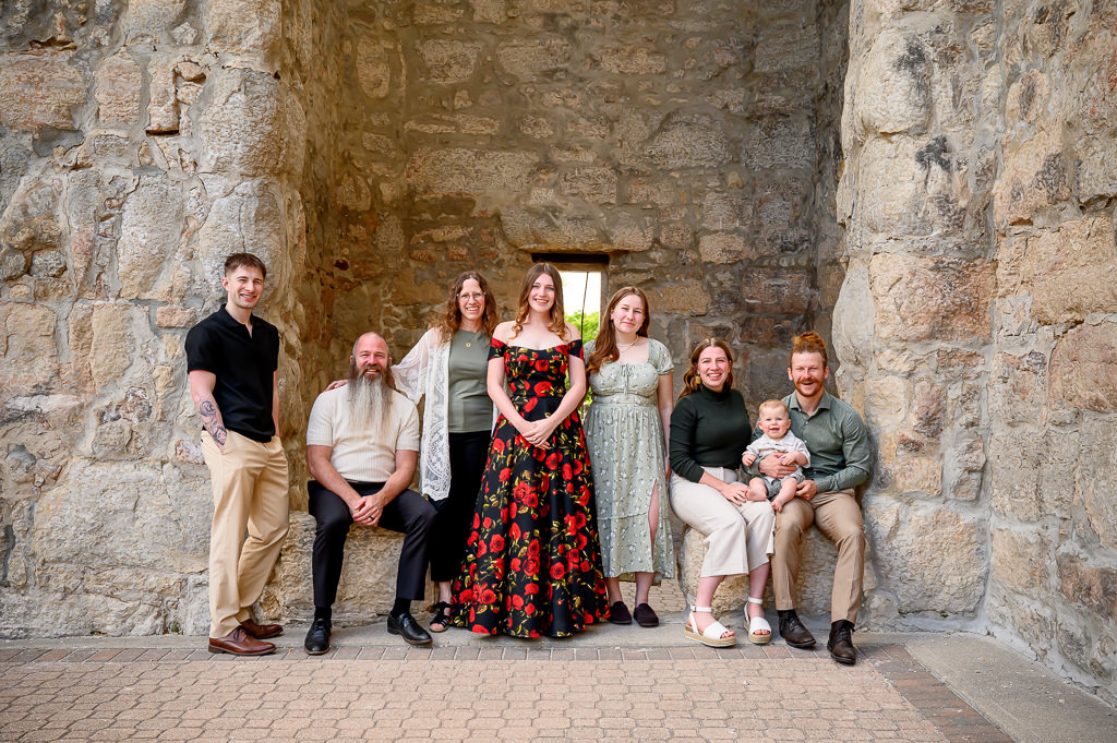 multi family photo posing in St. Boniface Cathedral ruins in Winnipeg