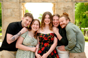 a fun sibling photo at a family session in St. Boniface