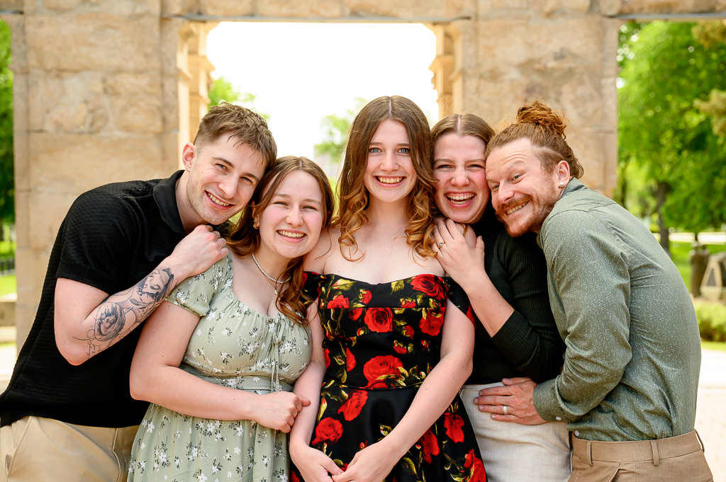 a fun sibling photo at a family session in St. Boniface