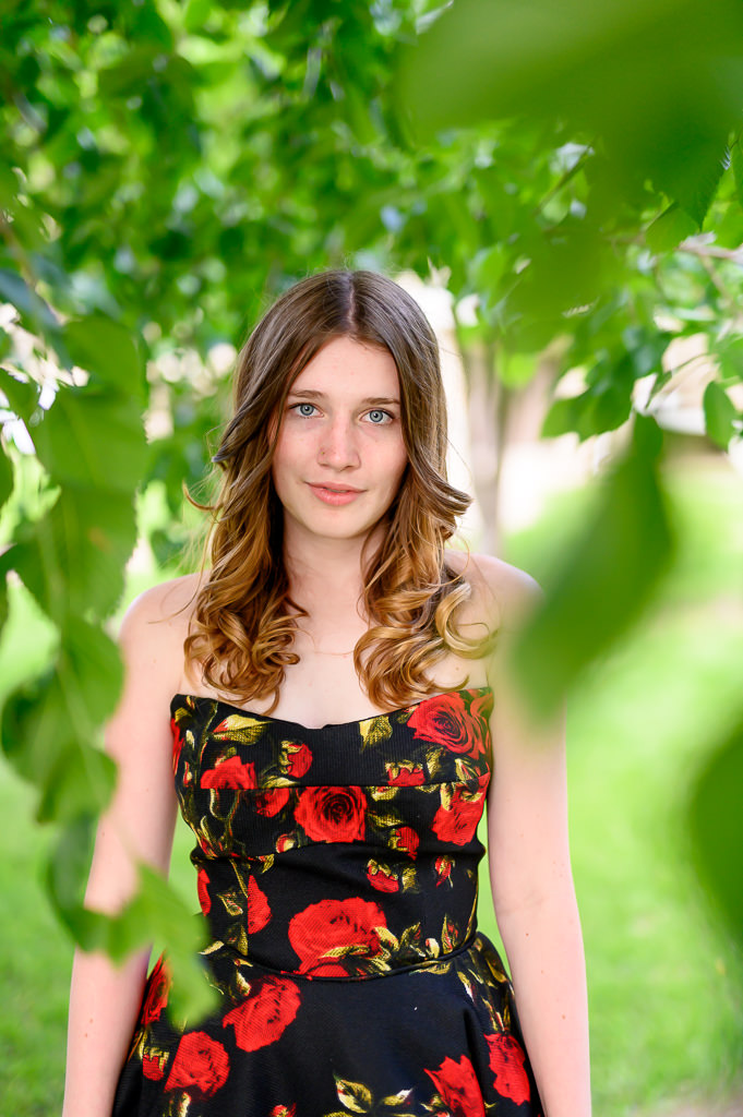 High school graduate portrait amongst a weeping willow tree in Winnipeg