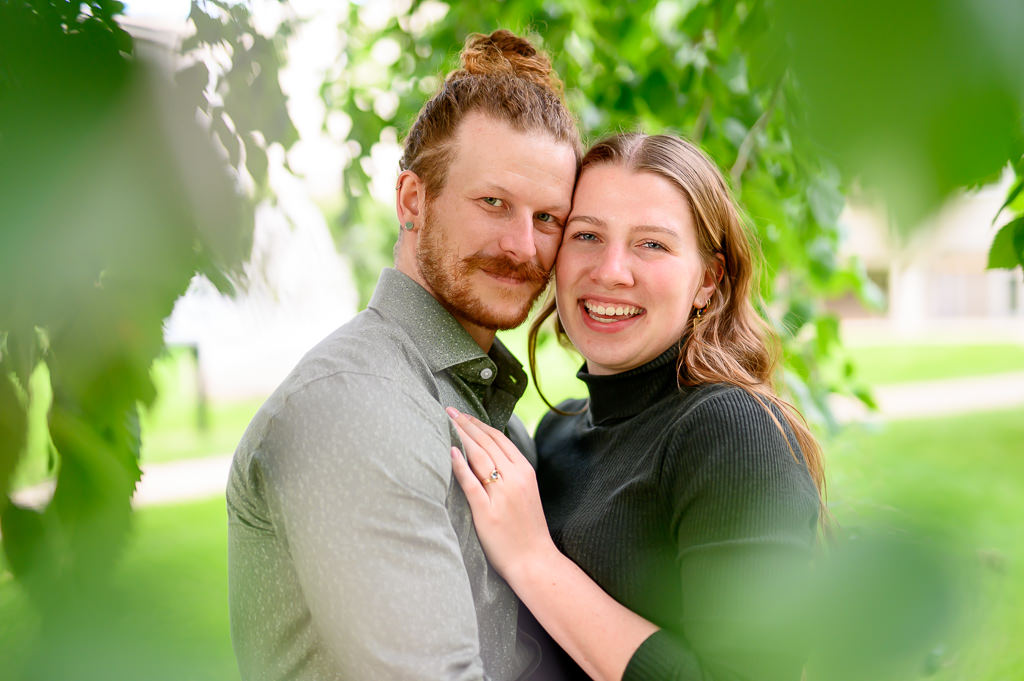 candid photo of a couple hugging and smiling