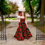 High School Grad Portraits at a historical location in Winnipeg with black iron gate and driveway
