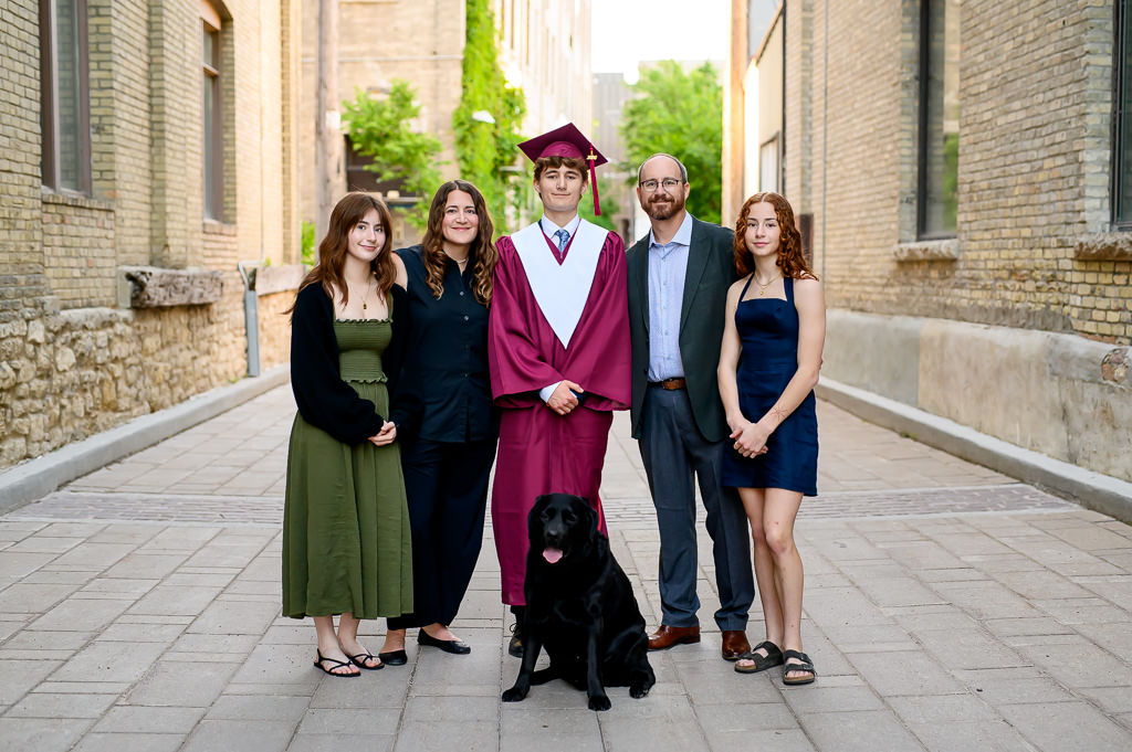 Winnipeg high school grad with his family in the exchange district