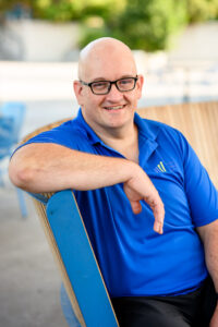 Business owner smiling during a headshot session in Winnipeg