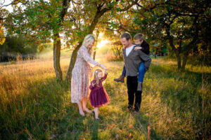 family enjoying a family photo session at Birds Hill Park