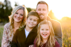 family posing together during an outdoor photo session